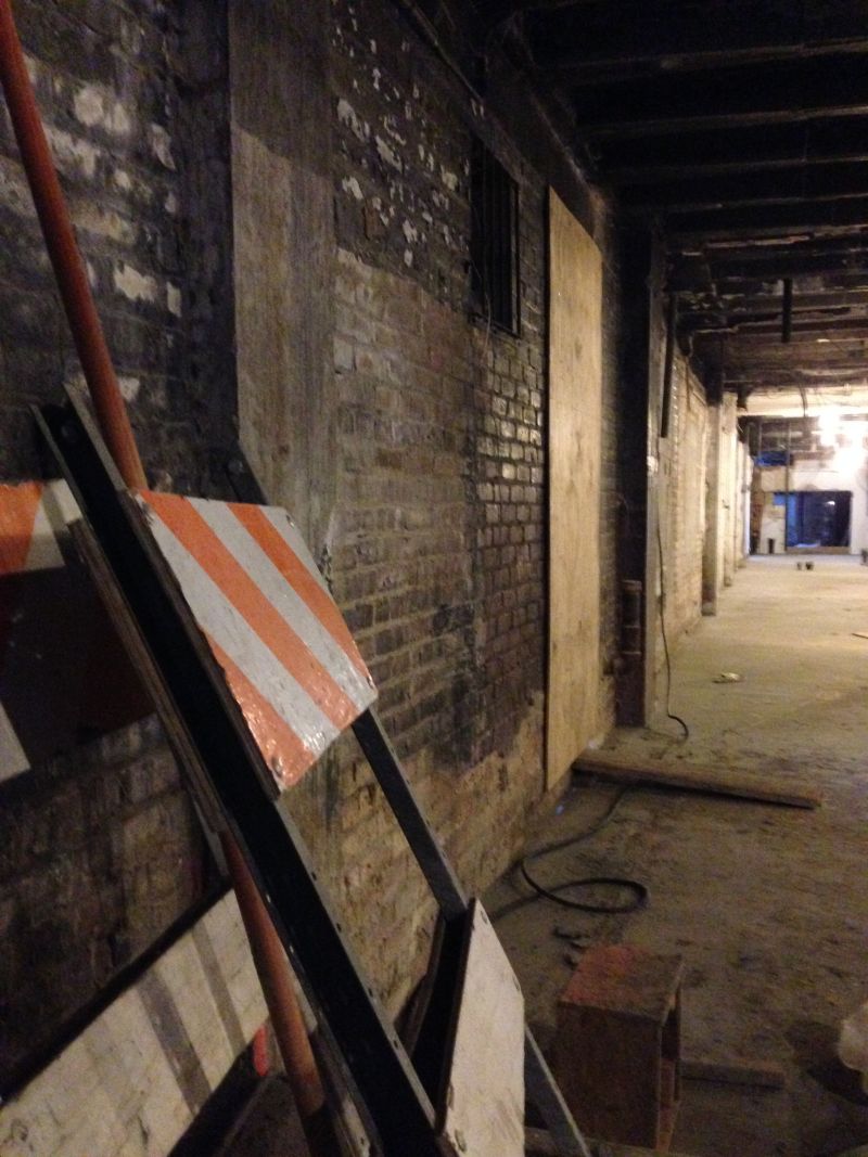 Construction Signs Next To The Wall