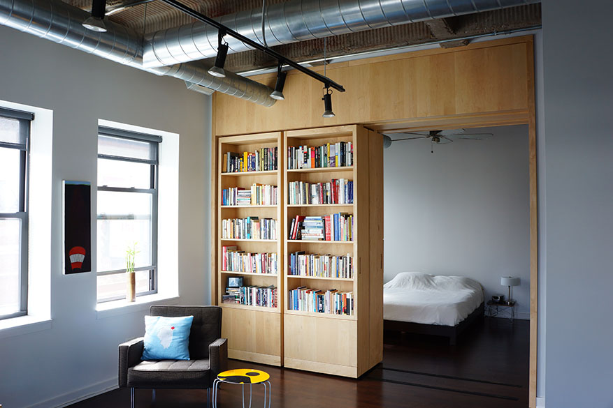 custom cabinetry, built-in sliding bookshelves