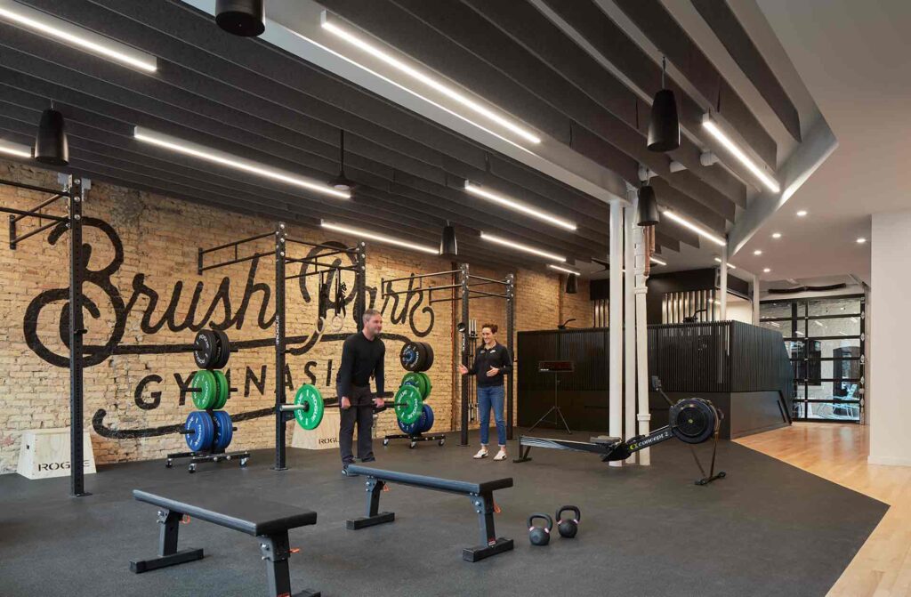 Brush Park Family Gym Man Lifting With Trainer