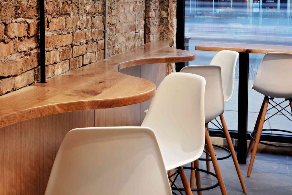 Dollop Coffee Montrose Table By Brick Wall