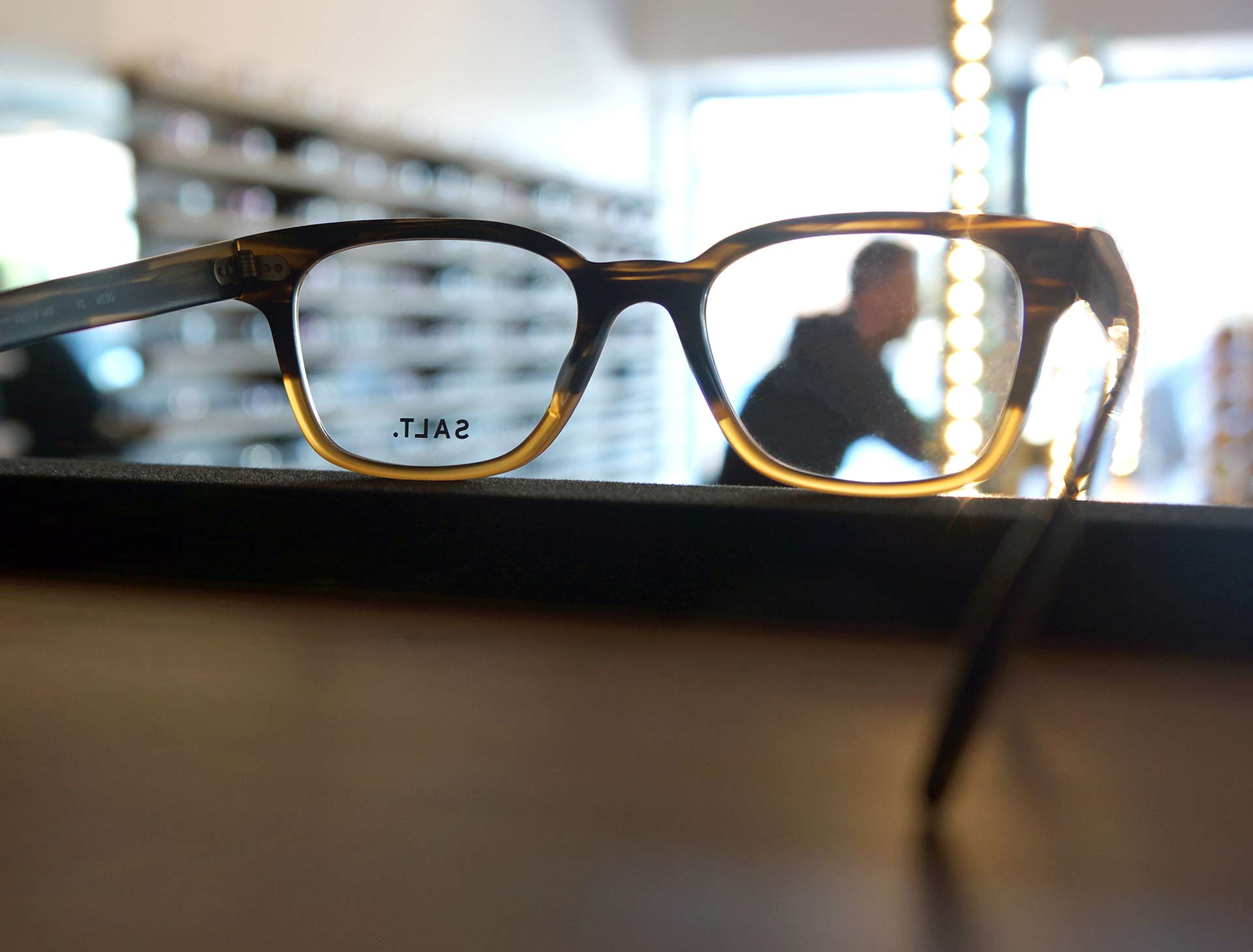 Uptown Family Vision Glasses With Person Out Of Focus