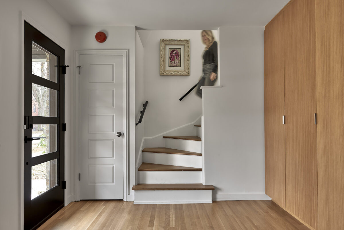 Moss Chicago Architect Home Renovation Cedar Siding entry interior with wood floor and wood entry stairs